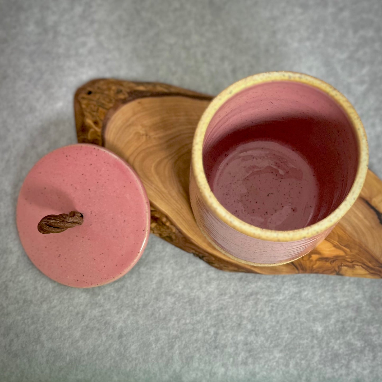 lidded jar with leather handle